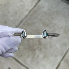 Load image into Gallery viewer, Open Silver bangle with  blue topaz at each end
